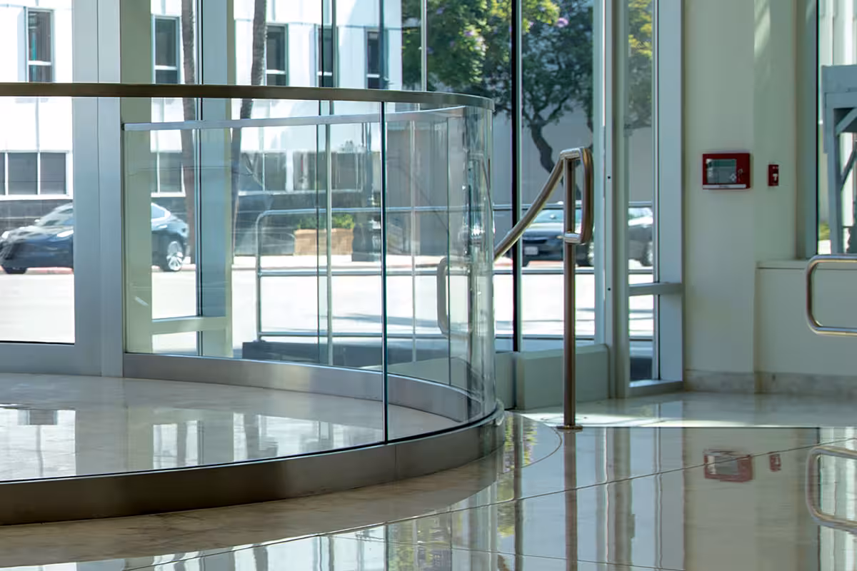 Curved interior glass railing in modern commercial building